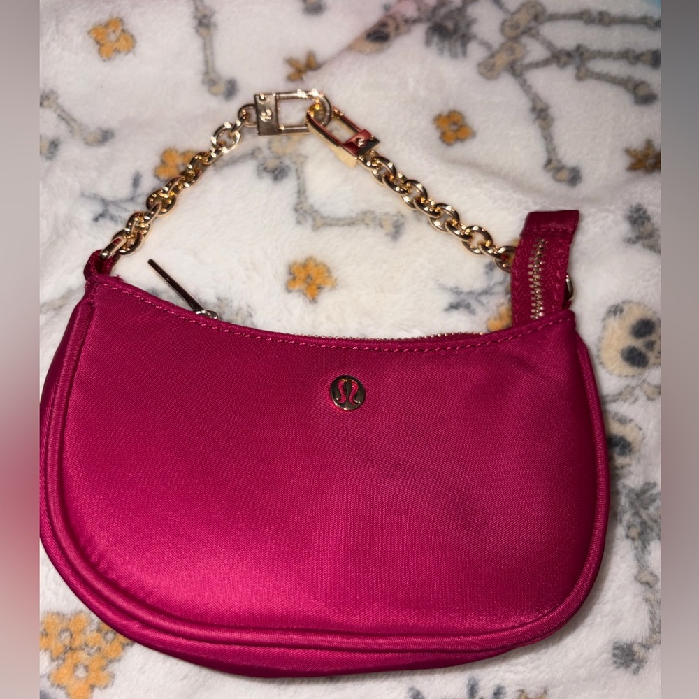 Like new lululemon athletica Pink Chain mini coin pouch Bag